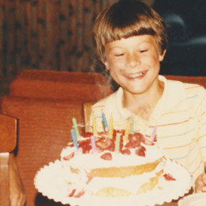 10-year-old with birthday cake