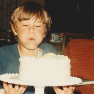 7 year old with birthday cake