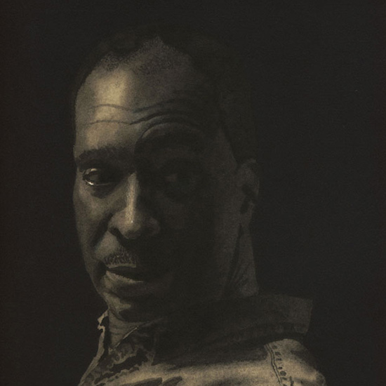 ortrait of man's head looking over his shoulder