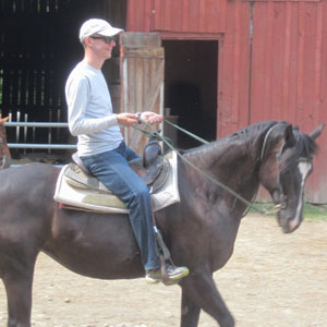 Tom riding a horse