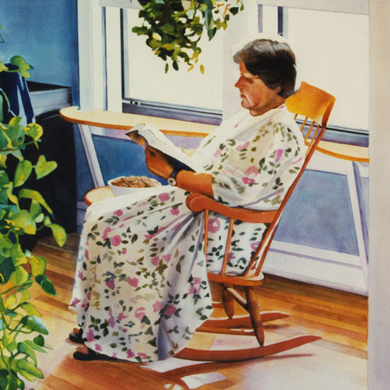 woman in a rocking chair reading a book