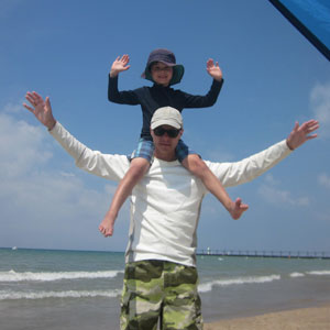 Theodore sitting on Tom's shoulders