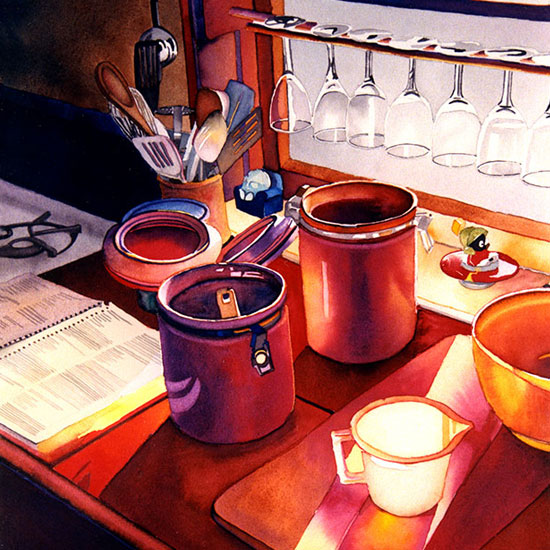 flour and sugar cannisters, a cookbook and a cutting board on a kitchen table