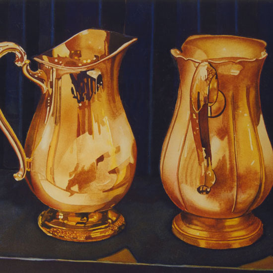 2 ornate silver pitchers