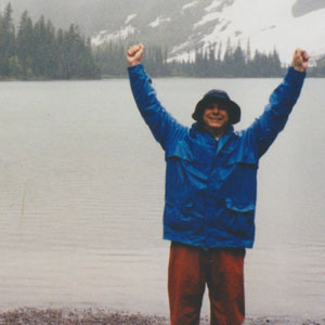 Tom raising arms in victory